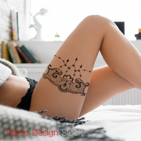 lace garter and pearl tattoo design