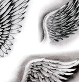 realistic wings tattoo design created by tattoodesignstock.com